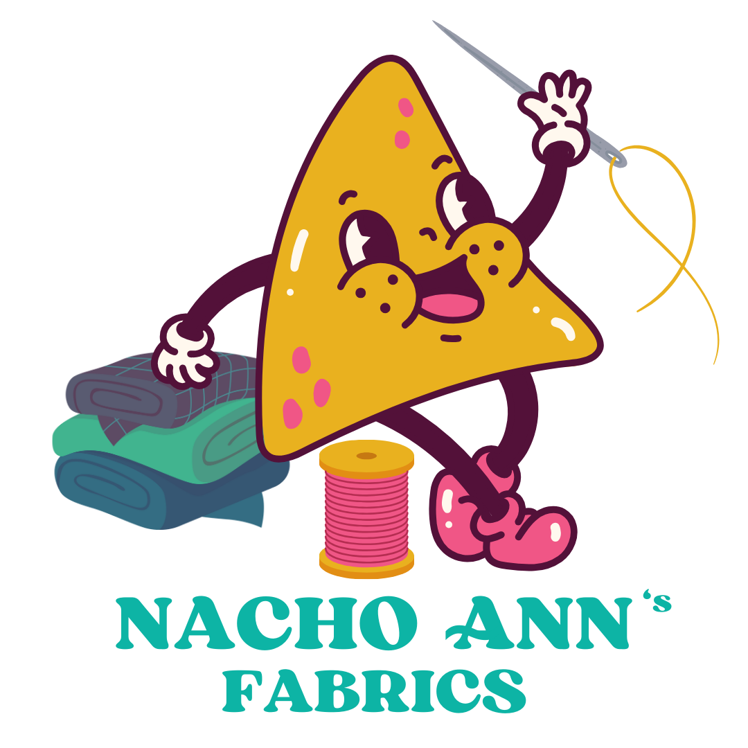 Cartoon triangle character with sewing equipment and 'Nacho Ann's Fabrics' text on a white background