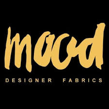 Mood Designer Fabrics logo in gold on a black background